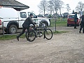 pushing a 1907 Moto Reve to the assembly area