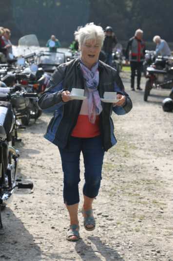 Shirley really does look after Les as she brings him a cuppa