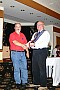 presenting Les Thomas with his trophy