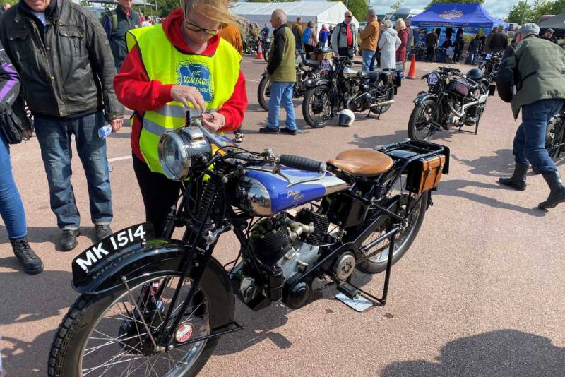 tying the rosette on Sammy Millers 1925 Grindlay Peerless